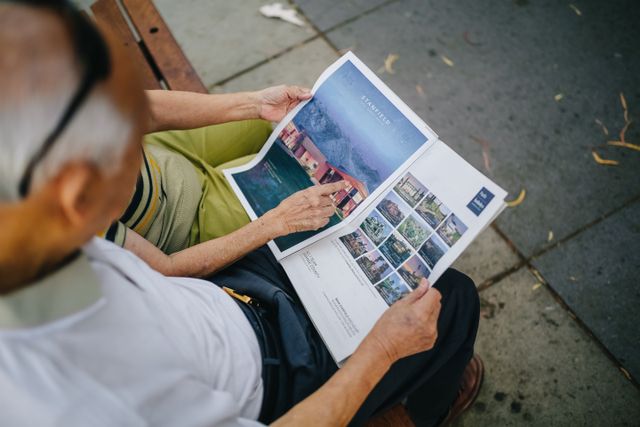 people reading a real estate pamphlet